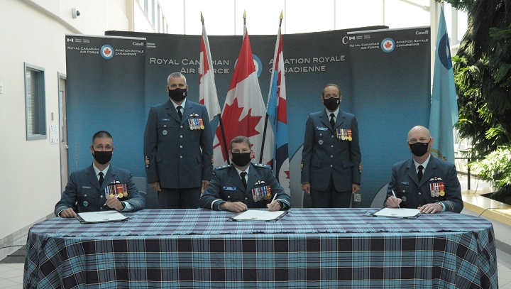 Col. C.Y. Jonathan Bouchard (bottom left) is the new wing commander of 15 Wing Moose Jaw after Col. Ron J. Walker (bottom right) relinquished the role on July 15. 