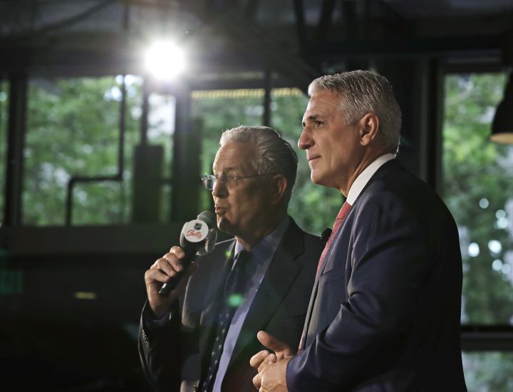 Ron Francis, right, and Seattle Hockey Partners CEO Tod Leiweke, left, take questions from reporters, Thursday, July 18, 2019, during a news conference in Seattle to introduce Francis as the first general manager for Seattle’s yet-to-be-named NHL expansion team.
