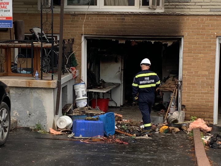 A fire investigator at the scene of a house fire in Mississauga on Saturday.