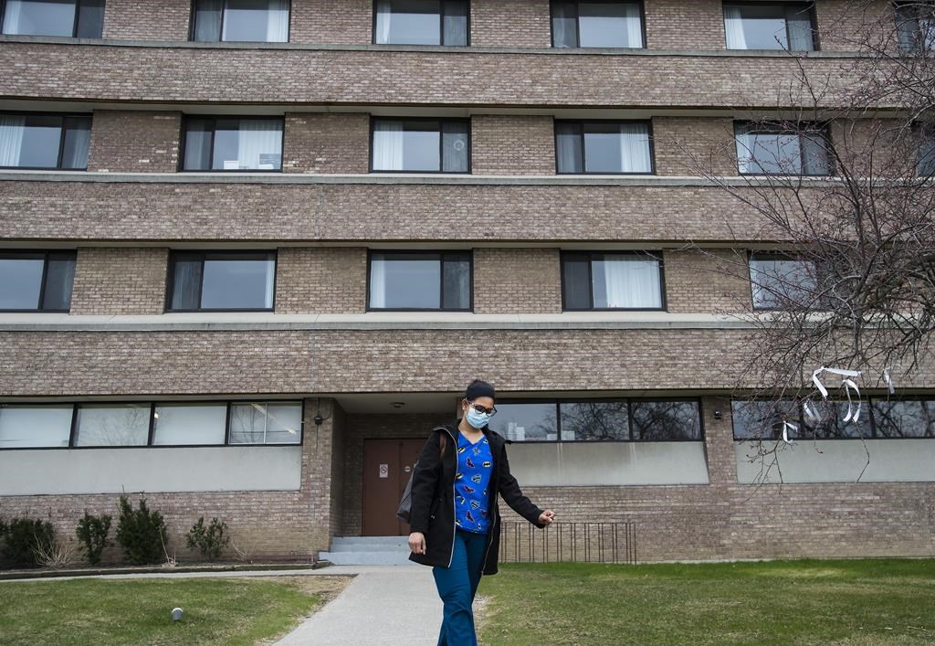 A health care worker leaves after finishing her shift for the day at the Eatonville Care Centre in Toronto on Friday, April 24, 2020. THE CANADIAN PRESS/Nathan Denette.