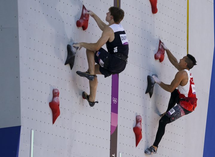 Sean McColl, right, of Canada competes against Colin Duffy of the United States in speed climbing at the men’s combined sport climbing event during the summer Tokyo Olympics on Tuesday, August 3, 2021.