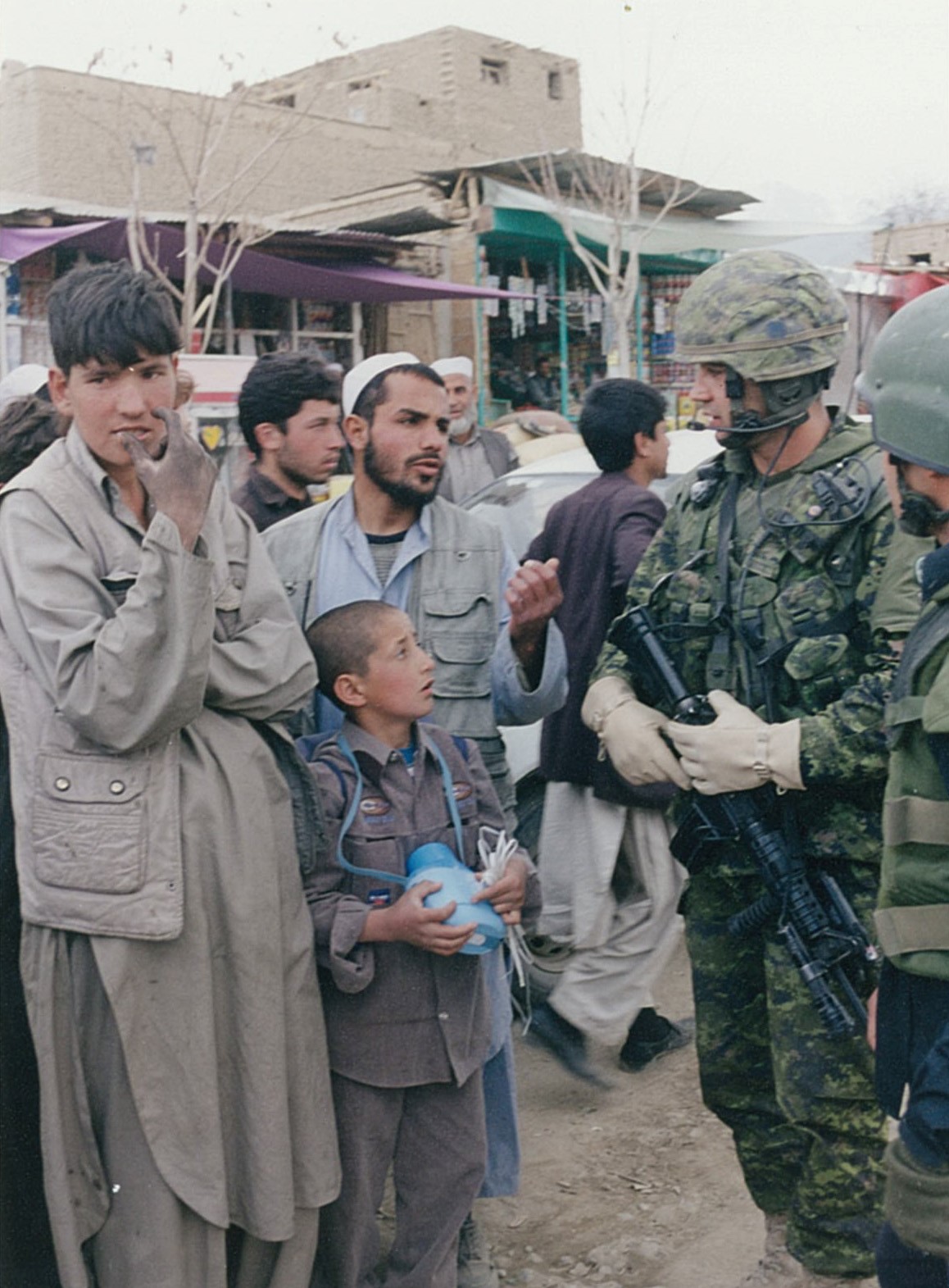 Canadian troops visiting a village in the mountains near Kabul. (2004)