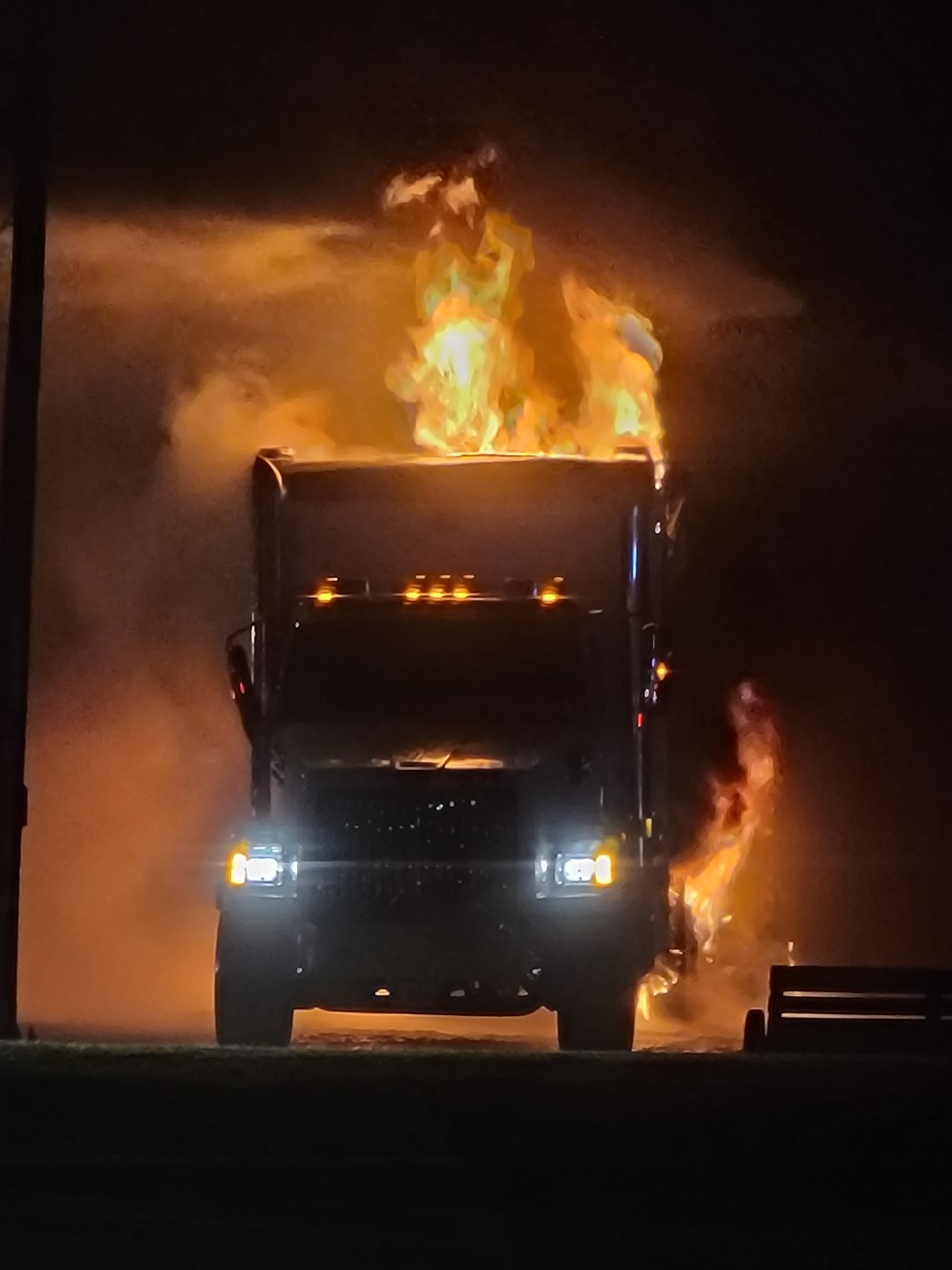 One of the two transport trucks on fire.