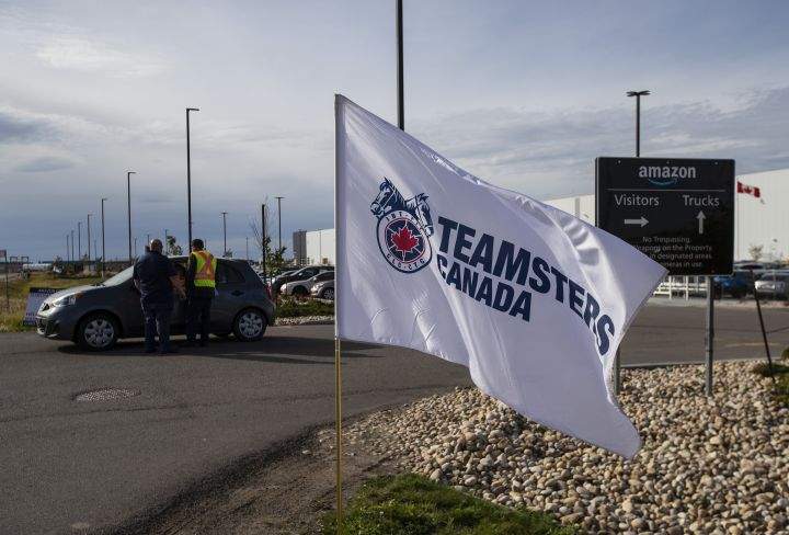 Organizers from Teamsters Local Union 362 rally outside an Amazon facility to get support and distribute information to Amazon workers, in Nisku, Alta, on Tuesday, September 14, 2021. 