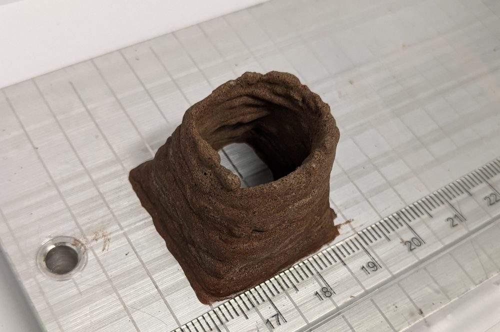 A piece of AstroCrete made from blood and dust is shown at a lab in the United Kingdom.