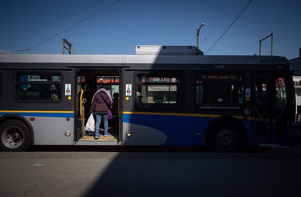 A man has been charged with assault in connection to an attack on a stranger aboard a Vancouver bus.