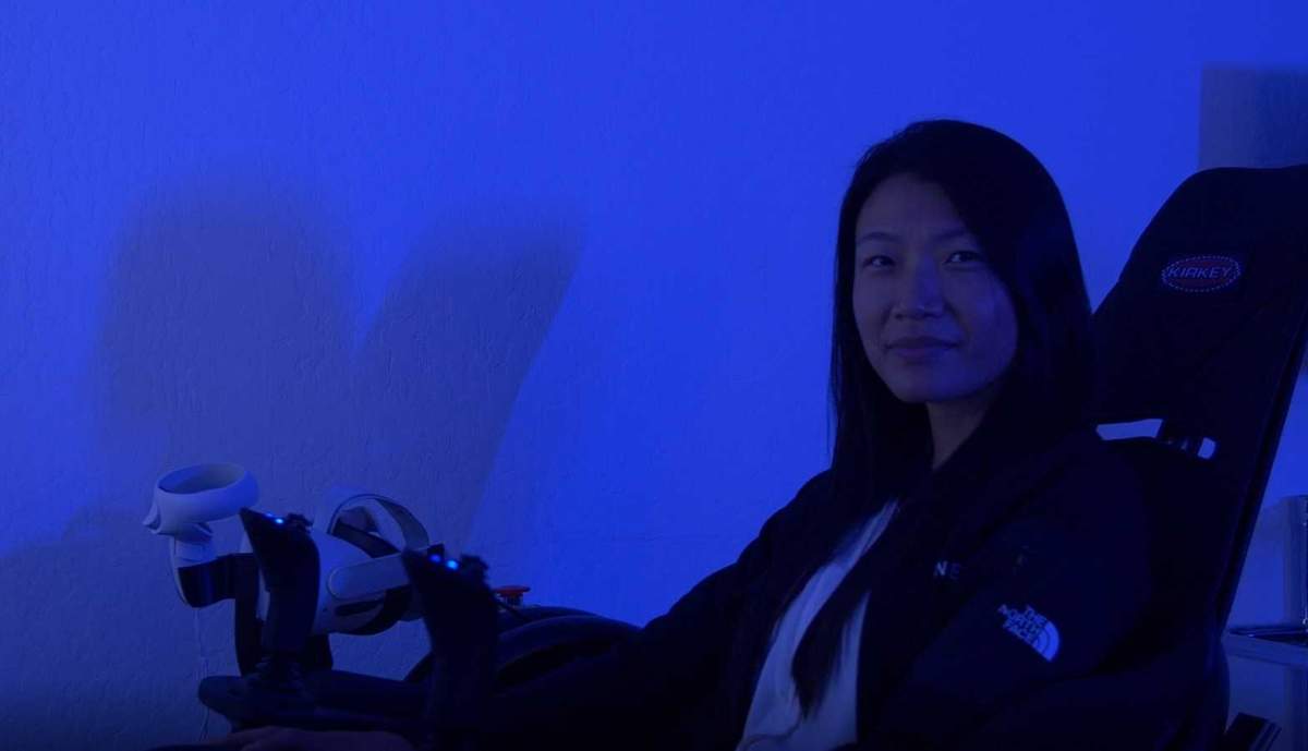 Eleanor Li, plant manager at Opener, in a flight simulator at the company headquarters in Palo Alto, Calif.