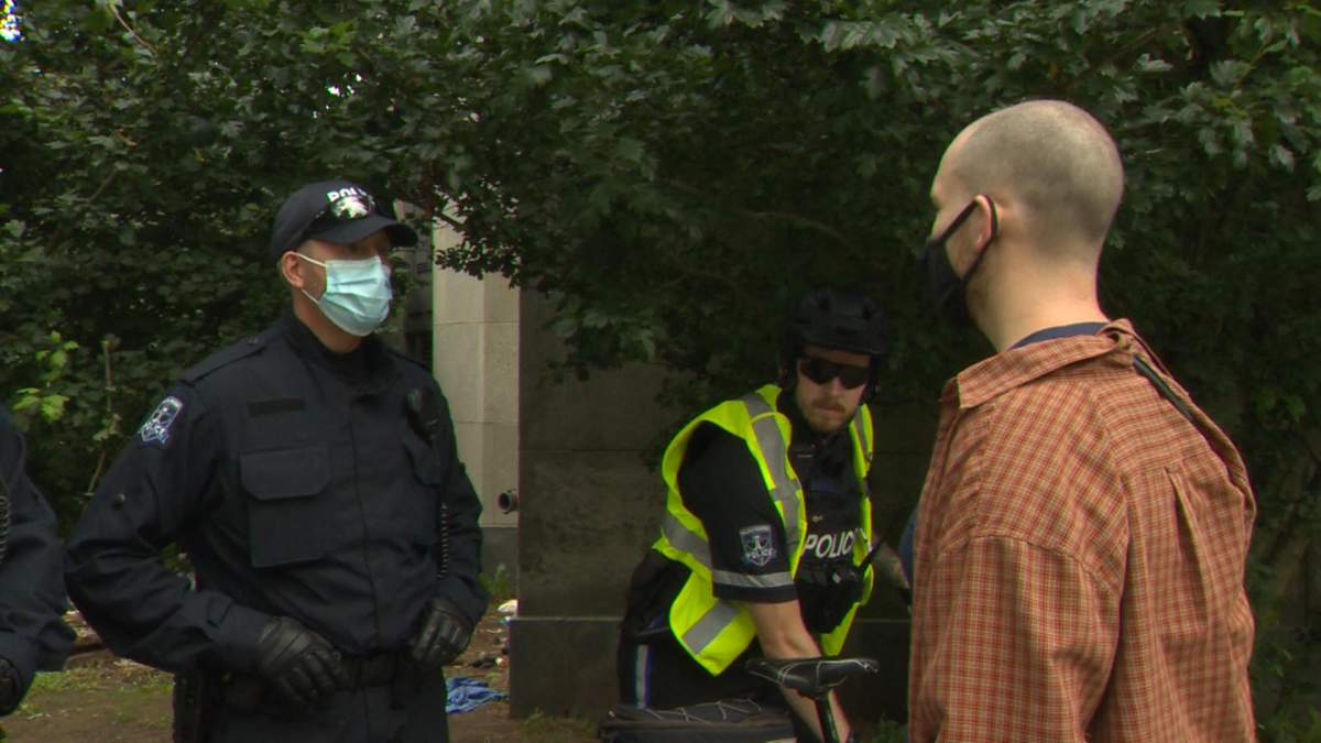 Photo of a police officer with no name tag on Aug. 18.