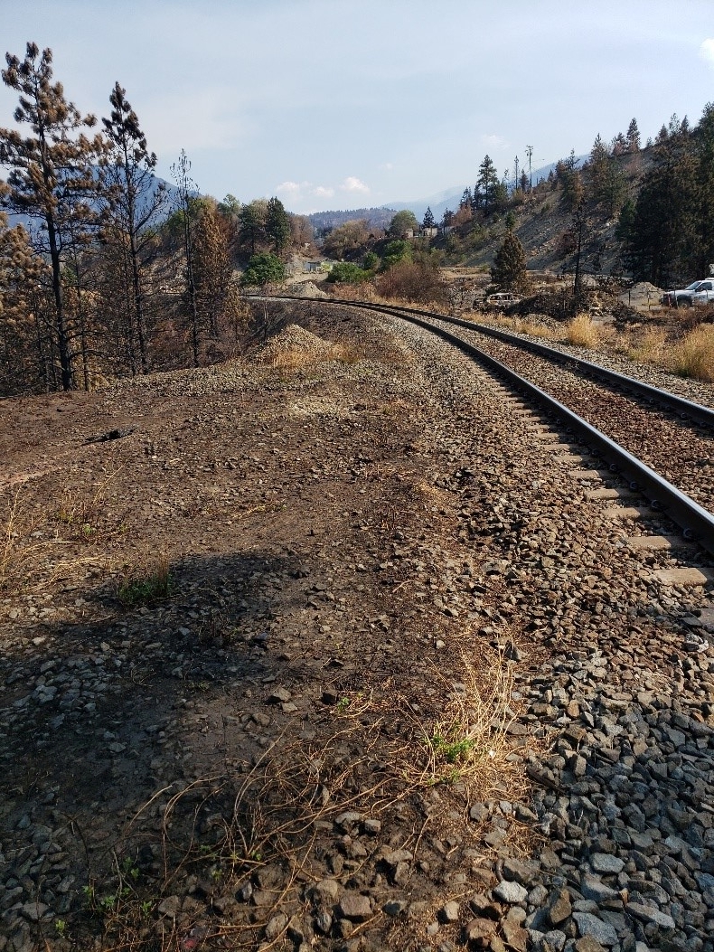 North edge of crossing at Mile 98.14 Ashcroft Sub looking eastward – BC Wildfire Service suspected origin of fire.