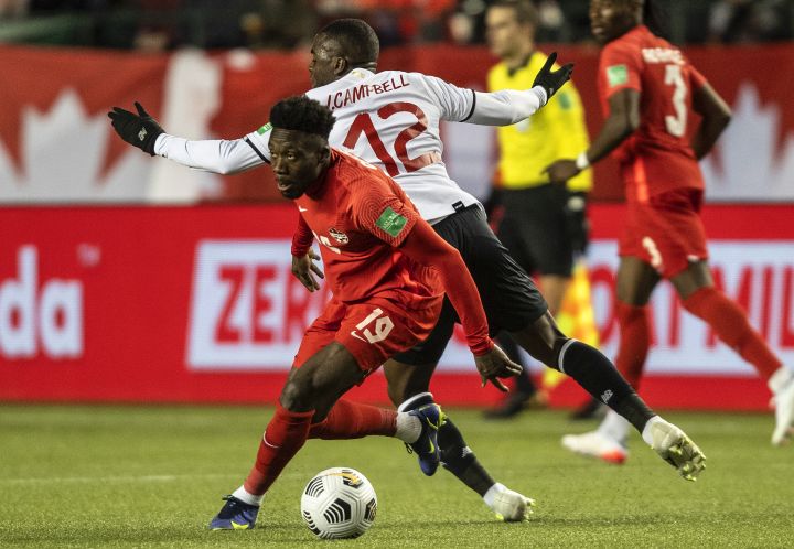 Team Canada’s Alphonso Davies (19) makes a move on Costa Rica’s Joel Nathaniel Campbell Samuels (12) during first half World Cup qualifier soccer action in Edmonton on Friday, November 12, 2021.