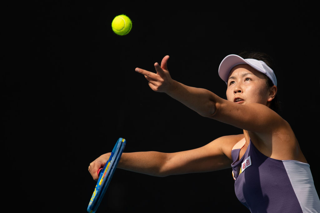 Peng Shuai serves a tennis ball to an opponent