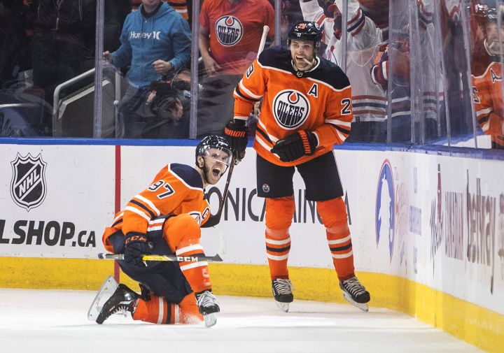 Edmonton Oilers’ Connor McDavid (97) and Leon Draisaitl (29) celebrate a goal against the New York Rangers during third period NHL action in Edmonton on Friday, November 5, 2021.