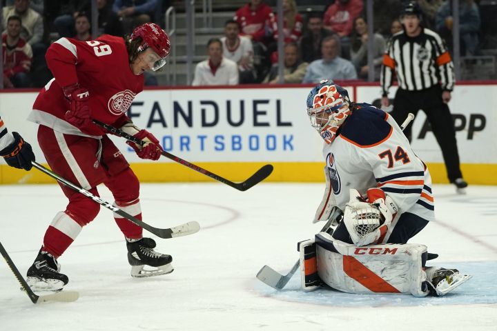 Edmonton Oilers goaltender Stuart Skinner (74) stops a Detroit Red Wings left wing Tyler Bertuzzi (59) shot in the second period of an NHL hockey game Tuesday, Nov. 9, 2021, in Detroit.