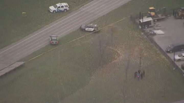 Police are seen at York Memorial Collegiate Institute after a stabbing incident Tuesday.