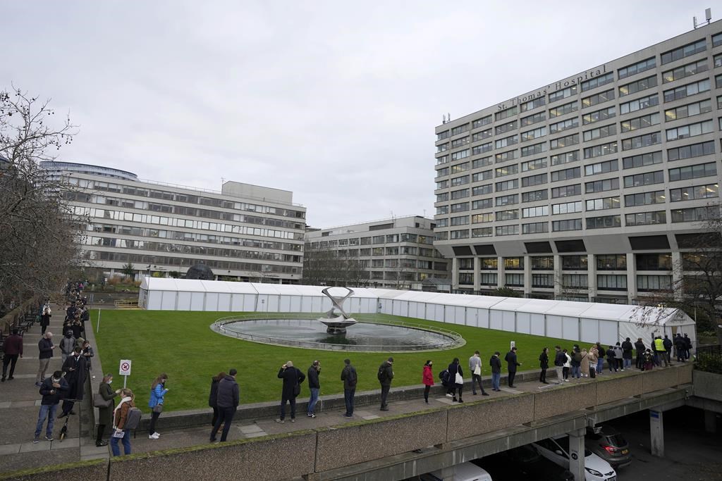 Photo of people lining up for vaccine shots in U.K.