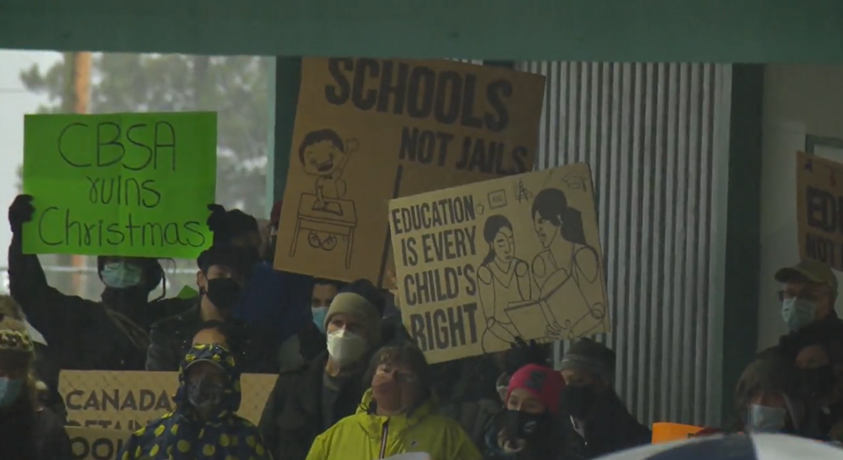 Parents and advocates for migrant rights demonstrate at Lord Tweedsmuir Elementary School in New Westminster on Saturday.