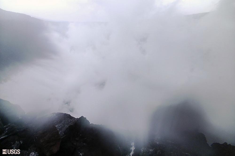In this webcam image provided by the U.S.Geological Survey, steam rises from the west rim of the summit collapse on Kilauea in Hawaii, Monday, Dec. 6, 2021.