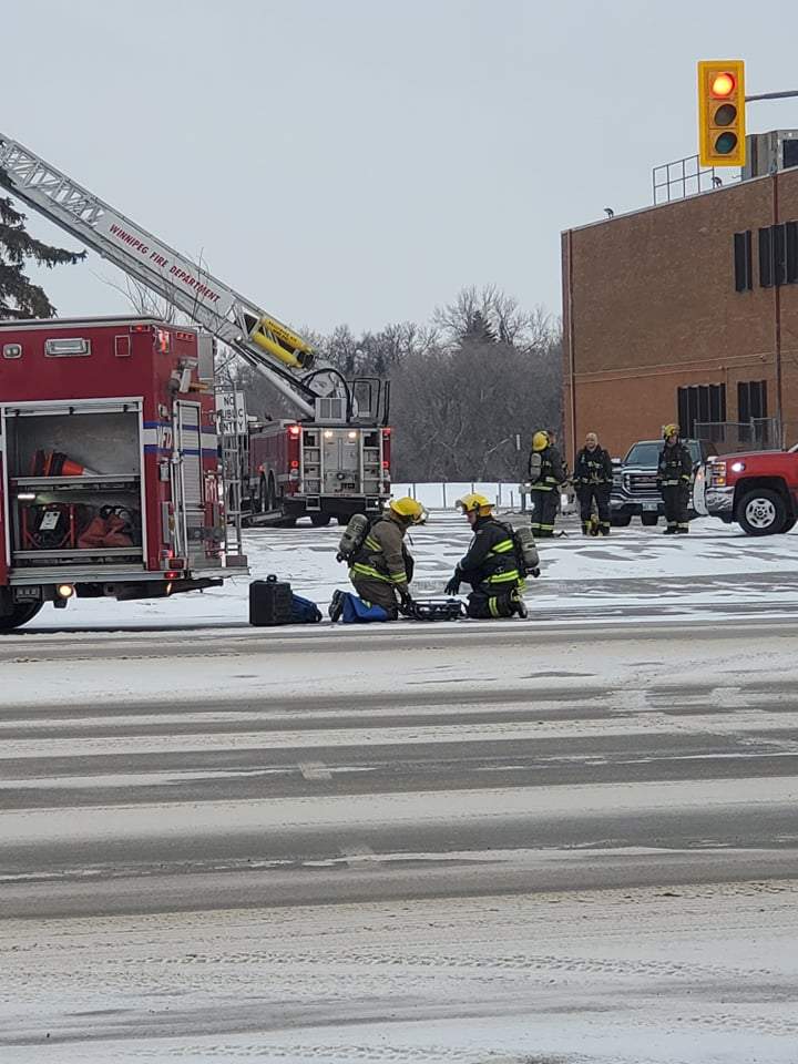 Firefighters attend to a fire at St. James Collegiate Sunday morning.