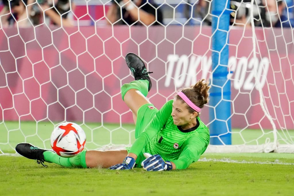 Canada's Stephanie Labbe makes a save against Sweden in the sixth round of the penalty shoot-out in the women's soccer final during the summer Tokyo Olympics in Yokohama, Japan on Friday, August 6, 2021.