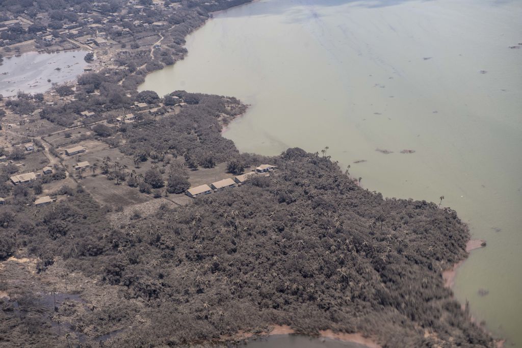 An aerial photo shows a blanket of ash covering parts of Tonga.
