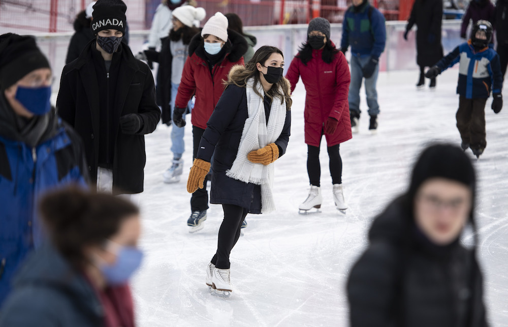 People skate on the Rink of Dreams at City Hall in Ottawa, on Tuesday, Dec. 28, 2021. 