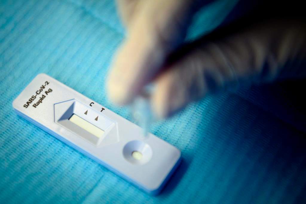 A health worker performs a 'SARS-CoV-2 Rapid Antigen' test in Lausanne, Switzerland, Monday, Nov. 9, 2020. 