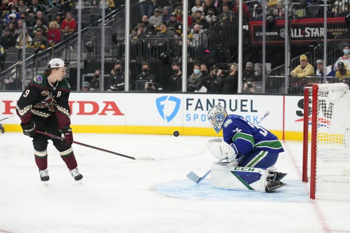 Vancouver Canucks goalie Thatcher Demko, right, and Phoenix Coyotes’ Clayton Keller participate in the Skills Competition save streak event, part of the NHL All-Star weekend, Friday, Feb. 4, 2022, in Las Vegas.