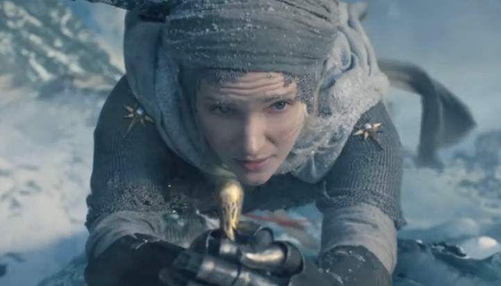 The character of Galadriel climbs a waterfall in full armour.