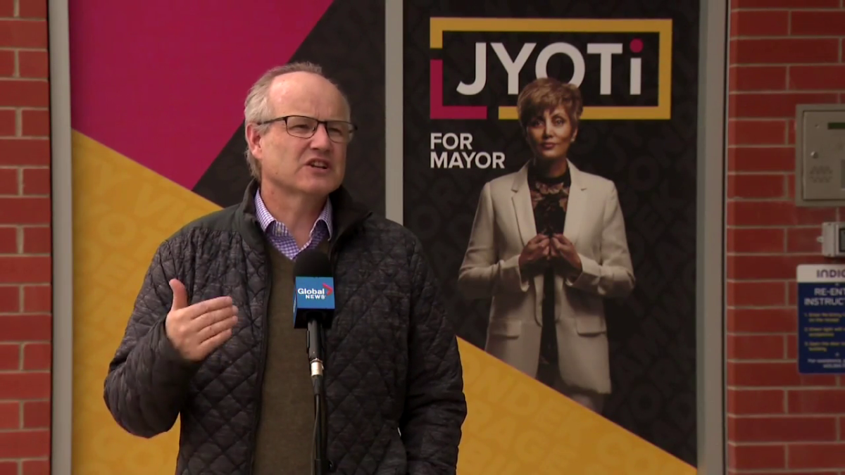 Stephen Carter standing in front of the Jyoti Gondek campaign headquarters