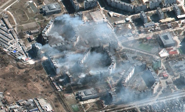 Satellite imagery shows burning apartment buildings likely shelled by artillery in northeast Mariupol