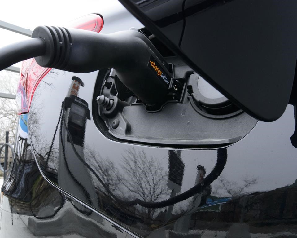 A car is charged at a charge station for electric vehicles on Parliament Hill in Ottawa on Wednesday, May 1, 2019.