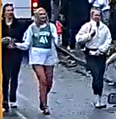 The woman, pictured, is described as blond and was wearing a white jacket and skirt as well as a green shirt with 41 on the front.