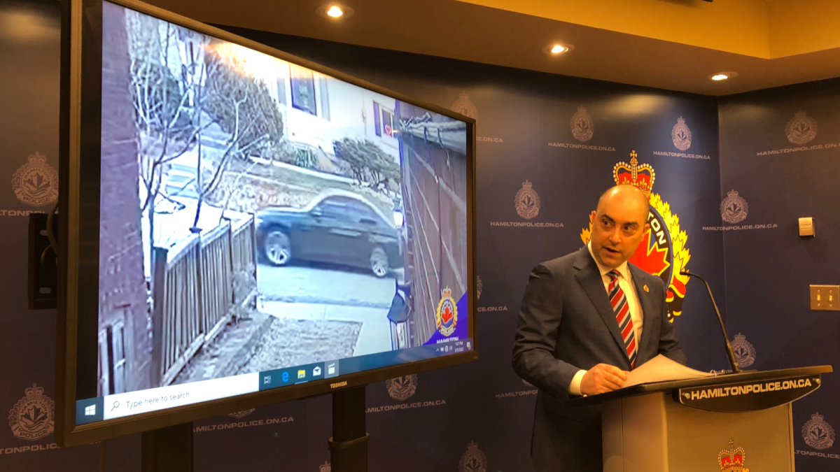 Detective Sergeant Steve Berezuik reveals an image of a suspect vehicle involved in the city's first homicide of the year.