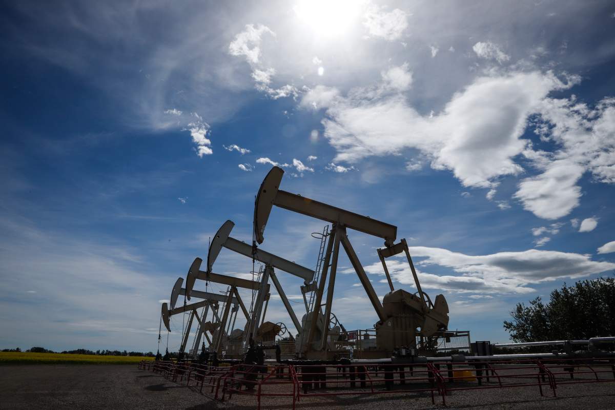 Pumpjacks draw oil out of the ground near Olds, Alta., on July 16, 2020. 