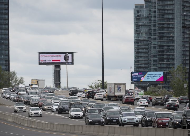 Vehicles drive along the Gardiner Expressway in Toronto at the start of the May long weekend on Saturday, May 22, 2021. 
