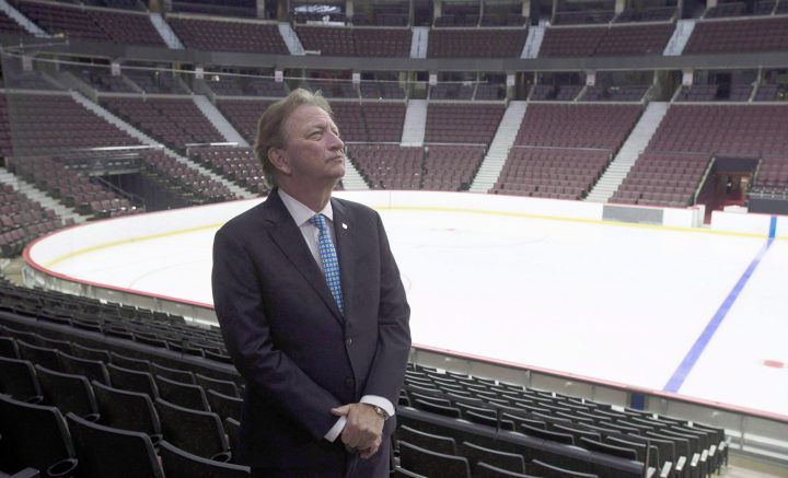 Ottawa Senators owner Eugene Melnyk stands near the ice as members of the media are given a tour of changes to the Canadian Tire Centre in Ottawa on September 7, 2017.