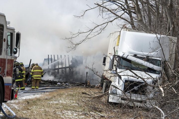 Firefighters work at the scene of a multi-vehicle crash on Interstate 81 North near the Minersville exit in Foster Township, Pa., Monday, March 28, 2022.