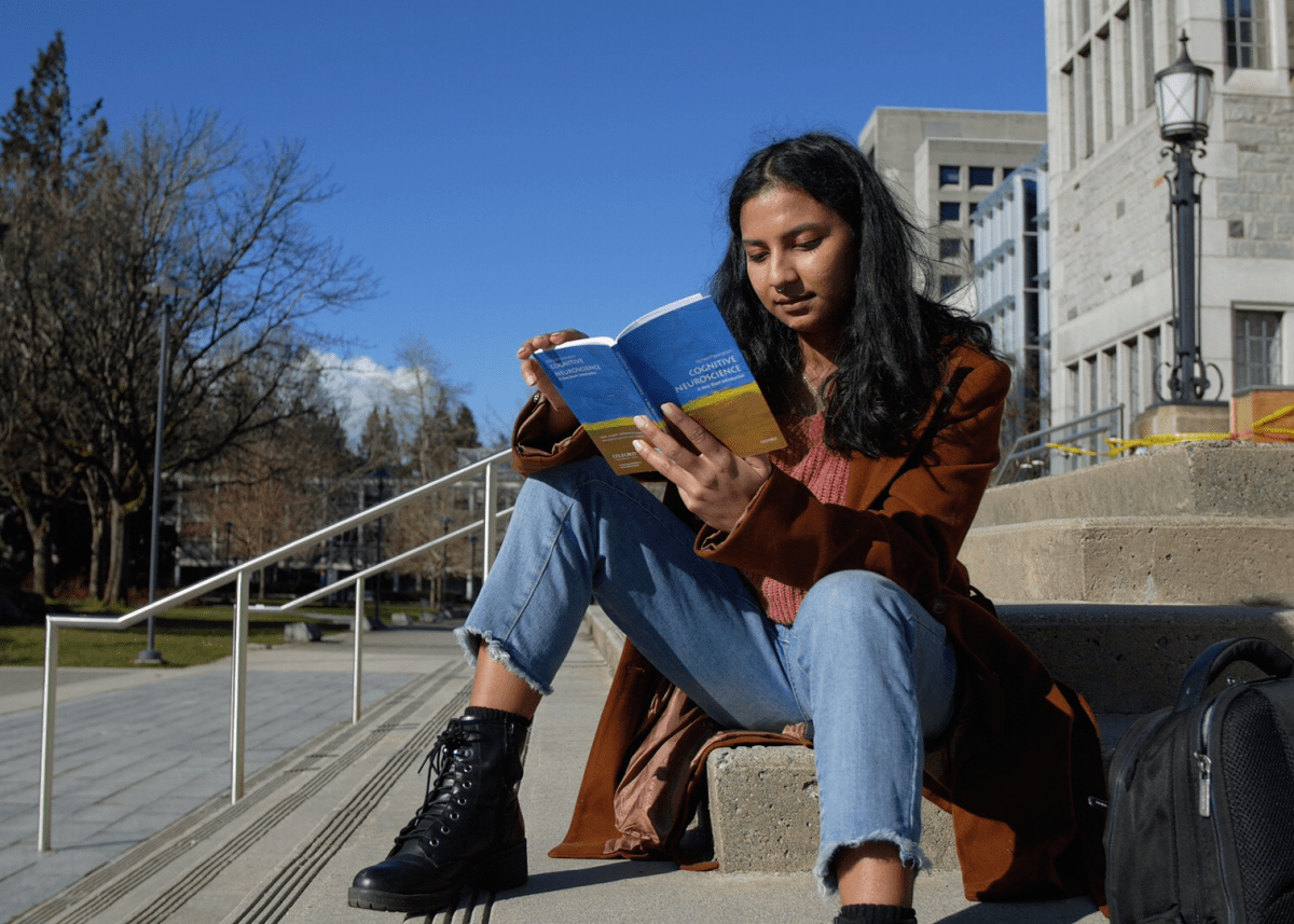 Rishika Bose reading on UBC’s campus. After completing her studies, she hopes to pursue a career in AI risk.