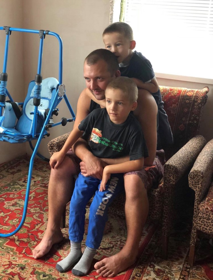 Yana Sheina’s uncle is seen with his two sons. Living near the Russian border in northeastern Ukraine, her family were among the first to encounter invading Russian troops.