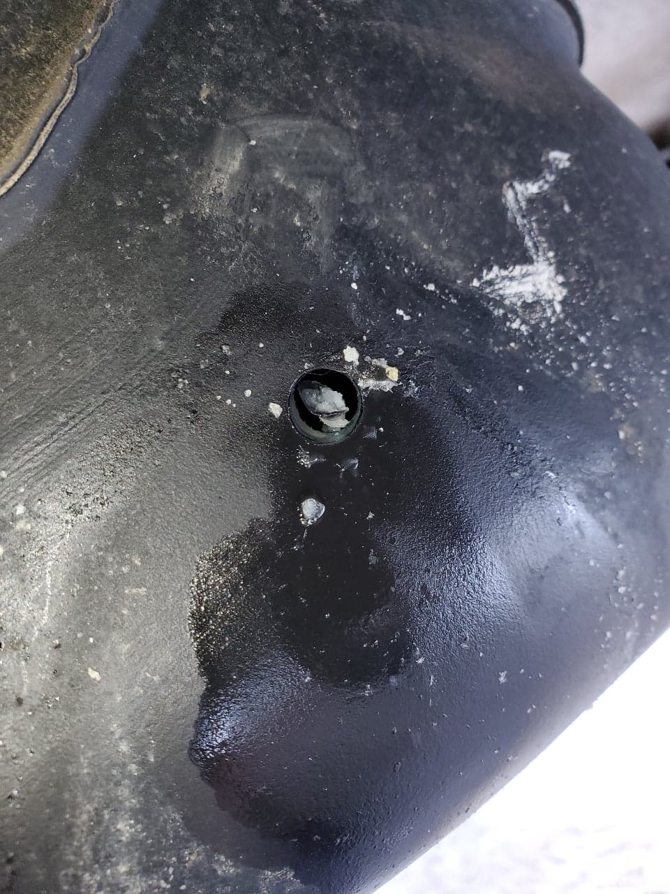 A hole in a van’s gas tank.