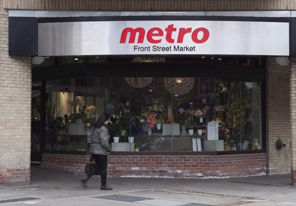 A woman walks pass a Metro grocery store in Toronto on Wednesday, Nov. 1, 2017. Unifor says it has reached a tentative agreement with Metro Inc. covering more than 900 full-time workers at a Toronto-area distribution centre.
THE CANADIAN PRESS/Doug Ives.