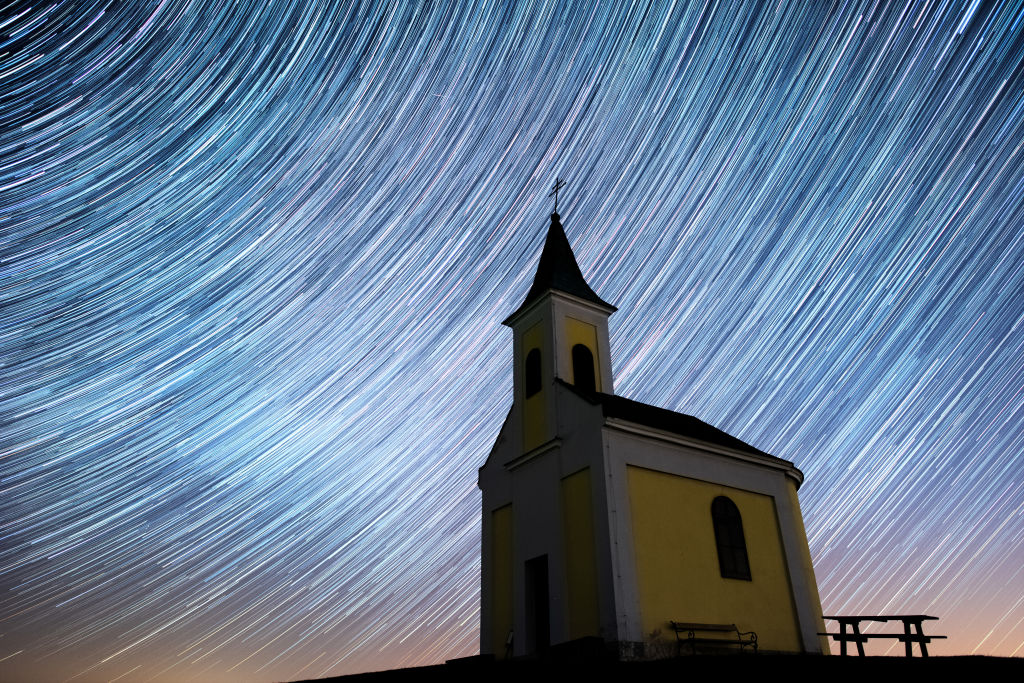 Multiple exposures were combined to produce this image of star trails seen during the Lyrids meteor shower over Michaelskapelle on April 20, 2020 in Niederhollabrunn, Austria.