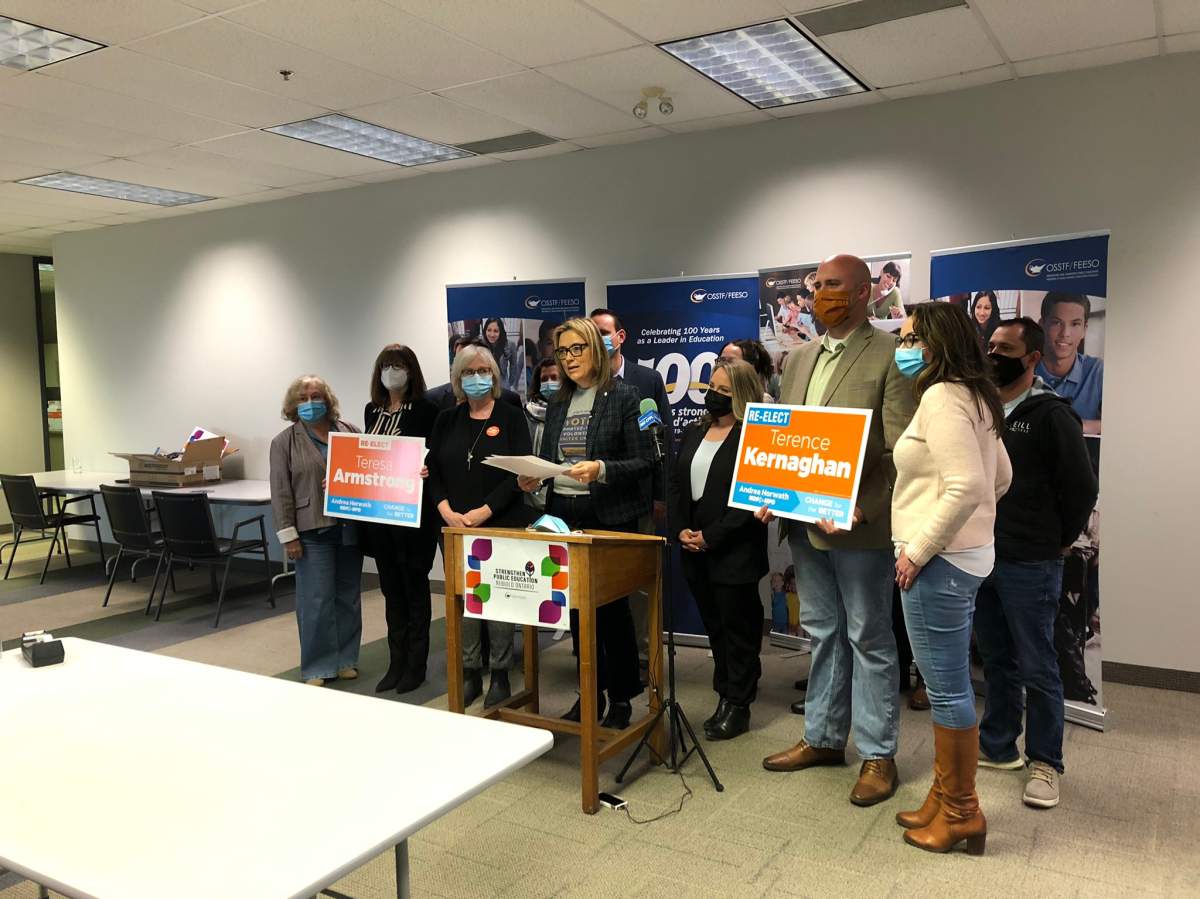 OSSTF president Karen Littlewood (centre) is joined by local Ontario NDP candidates and other supporters during Wednesday's news conference in London, Ont.