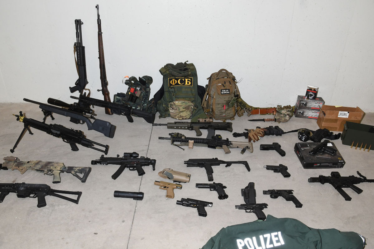 Waterloo Regional Police say officers seized 20 real and replica guns and more than 2,000 rounds of ammunition from an apartment building in Kitchener earlier this week.
