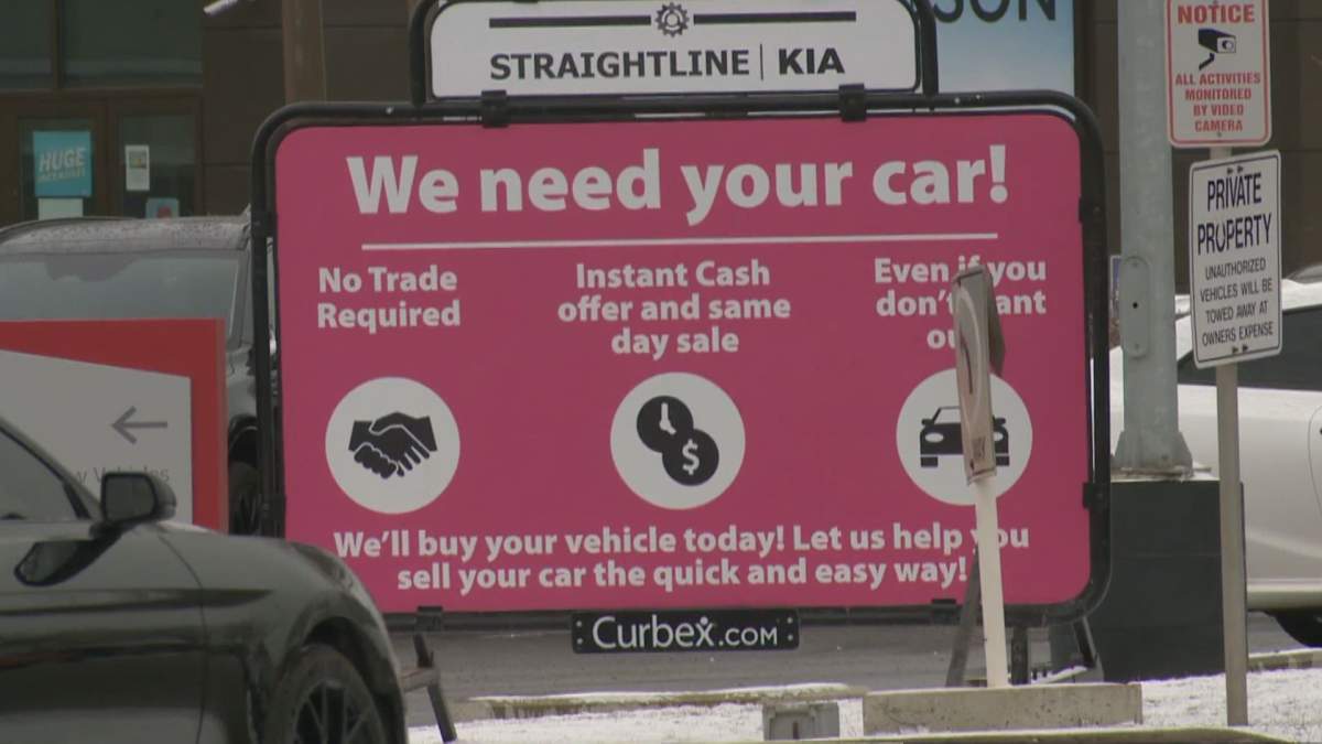 One Calgary dealership advertising the need for used cars