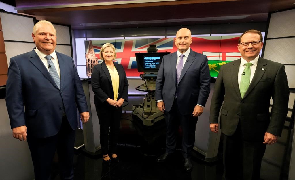 Ontario Progressive Conservative Party Leader Doug Ford, left to right, Ontario New Democratic Party Leader Andrea Horwath, Ontario Liberal Party Leader Steven Del Duca and Green Party of Ontario Leader Mike Schreiner pose for a photo ahead of the Ontario party leaders' debate, in Toronto, Monday, May 16, 2022. Ontario's election campaign will run half virtually, half in-person today, as the leaders for the New Democratic and Green parties isolate with COVID-19. THE CANADIAN PRESS/Frank Gunn.