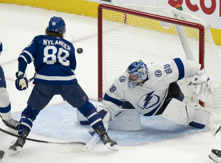 Tampa Bay Lightning goaltender Andrei Vasilevskiy (88) makes a save on Toronto Maple Leafs right wing William Nylander (88) during second period NHL first round playoff action in Toronto on Tuesday May 10, 2022.