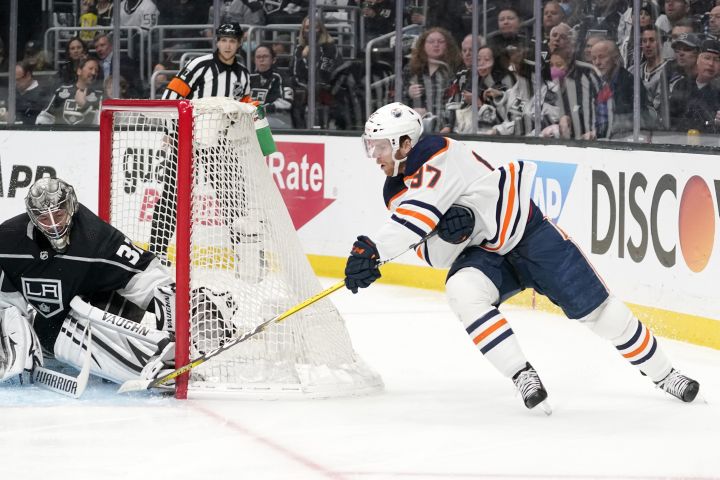Edmonton Oilers center Connor McDavid, right, scores on Los Angeles Kings goaltender Jonathan Quick during the first period in Game 6 of an NHL hockey Stanley Cup first-round playoff series Thursday, May 12, 2022, in Los Angeles.