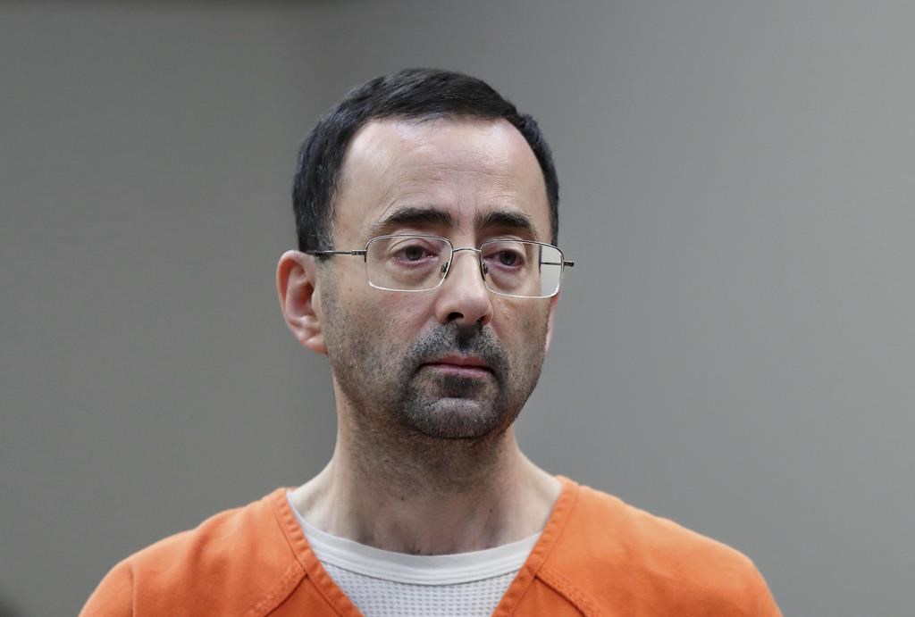 Dr. Larry Nassar, appears in court for a plea hearing on Nov. 22, 2017, in Lansing, Mich. The U.S. Justice Department said Thursday, May 26, 2022 it will not pursue criminal charges against former FBI agents who failed to quickly open an investigation of sports doctor Larry Nassar despite learning in 2015 that he was accused of sexually assaulting female gymnasts.