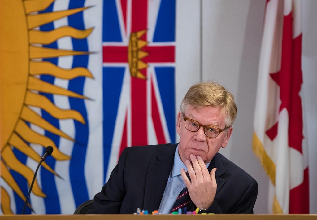Commissioner Austin Cullen listens to introductions before opening statements at the Cullen Commission of Inquiry into Money Laundering in British Columbia, in Vancouver, on Feb. 24, 2020. The commission's final report is set to be submitted to the government today. THE CANADIAN PRESS/Darryl Dyck.